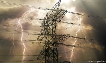 electric pole with thunders on the background