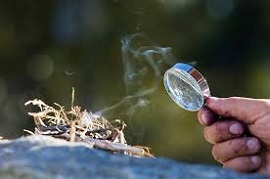 Making fire with a magnifying glass