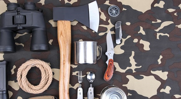 Bushcraft tools on camouflage background