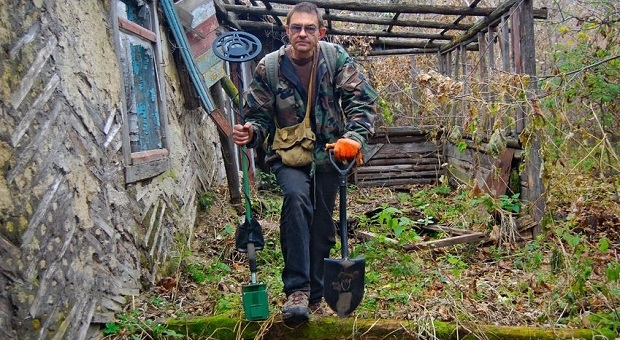 man scavenging for goods