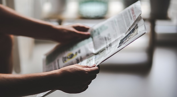 man reading newspaper